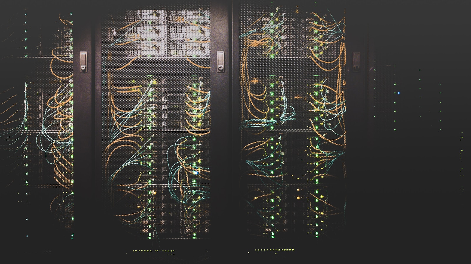 Server rack with glowing LEDs, representing the self-hosted Ghost era